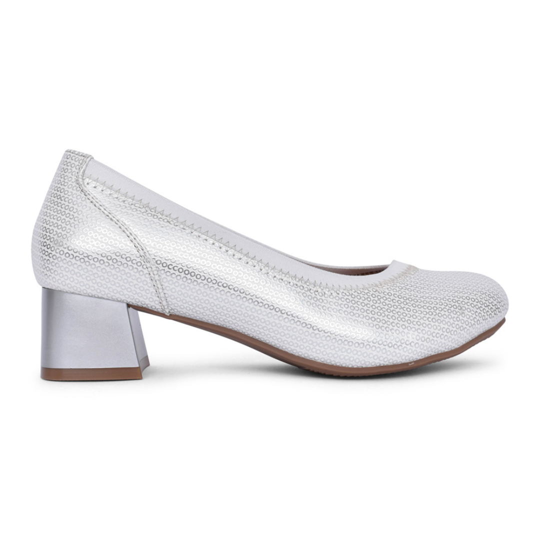 A silver slip-on shoe with a block heel, designed for women.