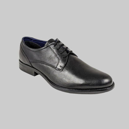Black leather dress shoe on a white background