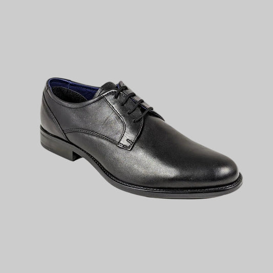 Black leather dress shoe on a white background