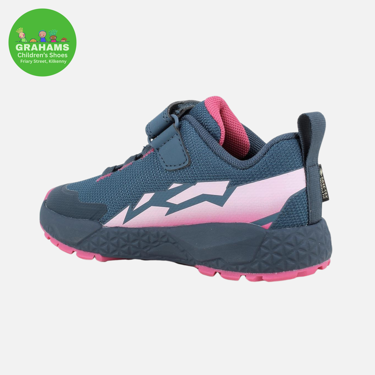 A children's athletic shoe in navy blue and pink, featuring a hook-and-loop strap closure, a textured sole, and a pink heel counter, shown against a light gray background with a green Grahams Children's Shoes logo in the top-left corner.